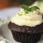 Homemade Fudgy Brownie Cupcakes with fresh whipped cream mint topping photo