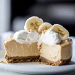 Homemade Peanut Butter Cheesecake with Whipped Marshmallow and Bananas. photo